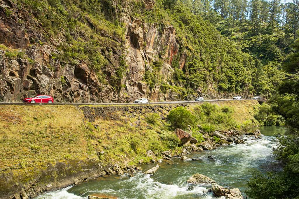 State Highway 2 winds along the opposite side of the river on the Karangahake Gorge Walk.