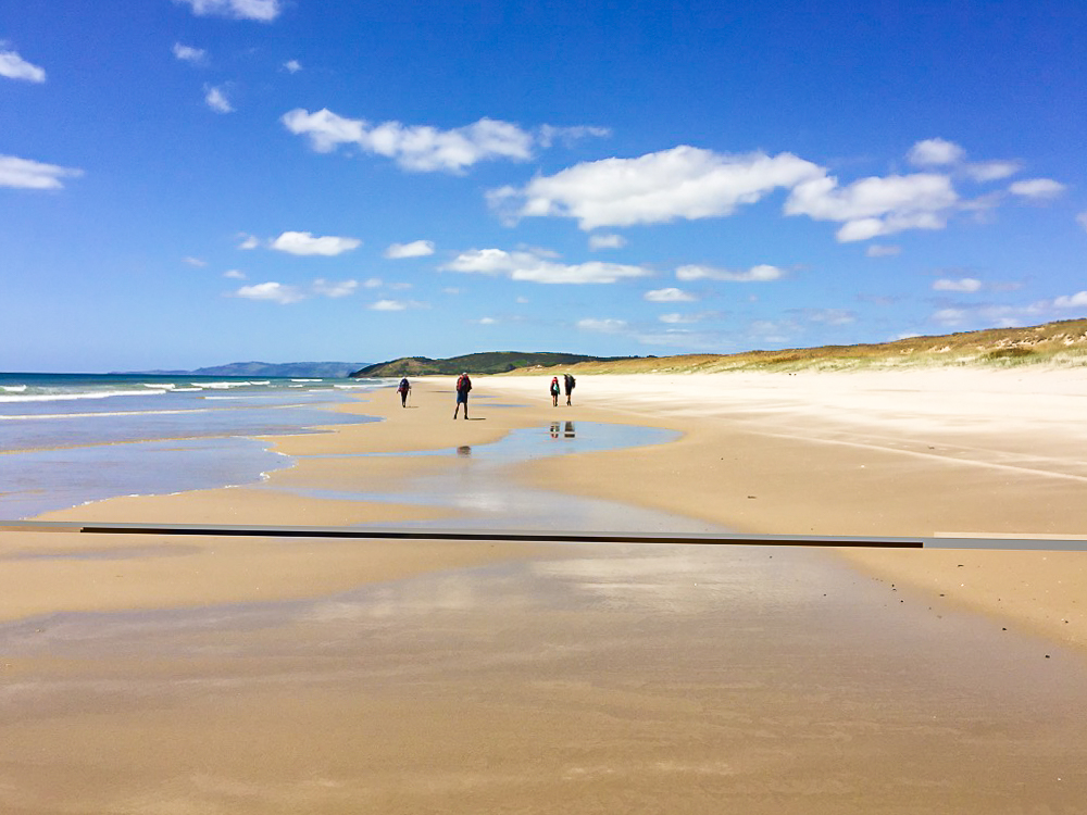 Four Hikers on the Pakiri Beach Walk - Te Araroa