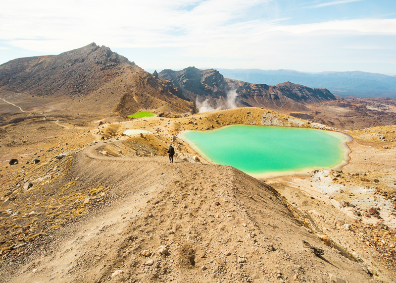 Hiking in New Zealand is different because the terrain is wild and rugged, such as the volcanic environments.