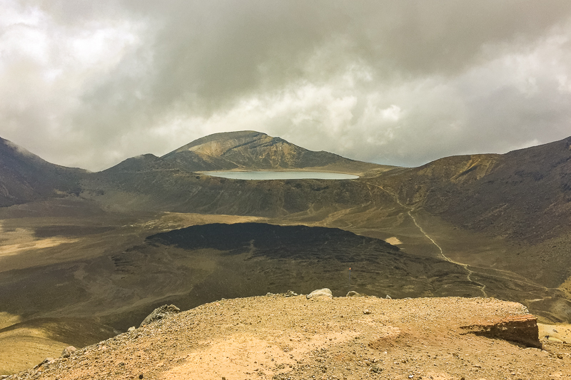 view of blue lake from red crater summit on the tongariro alpine crossing