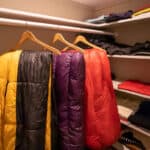 Hanging sleeping bags in cupboard.