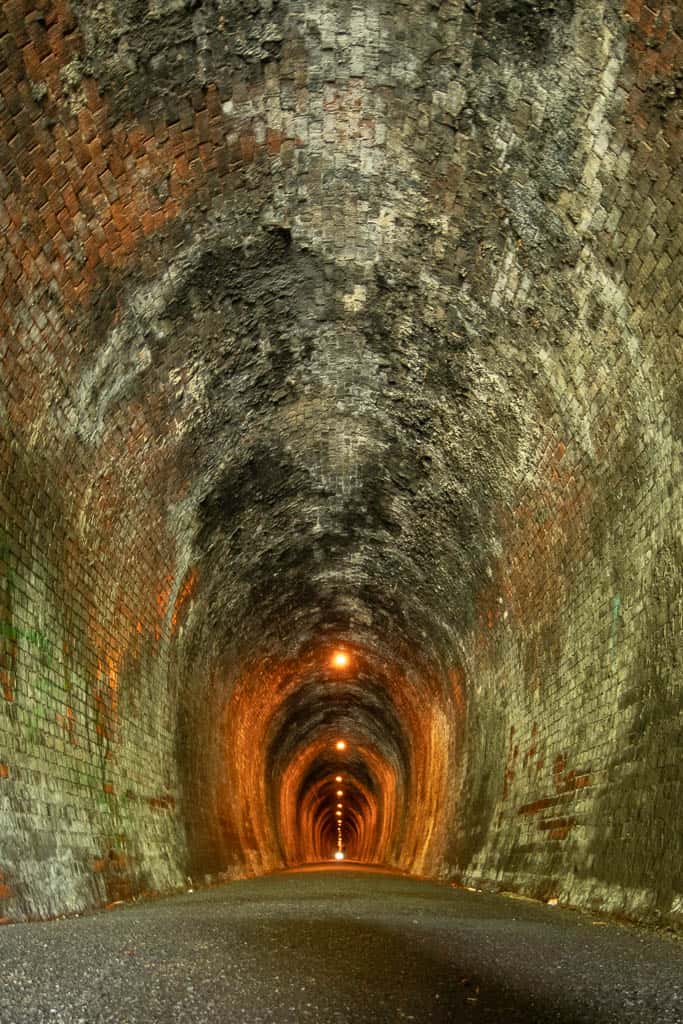 Looking down the 1.1km Rail Tunnel on the Karangahake Gorge Historic Walkway.